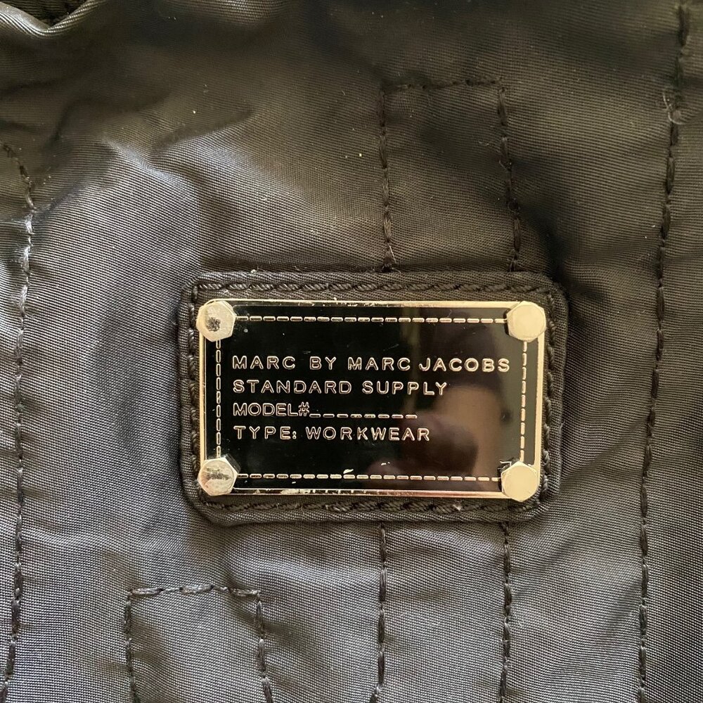 Stylish navy shoulder bag with a soft slouchy silhouette and subtle quilted stit